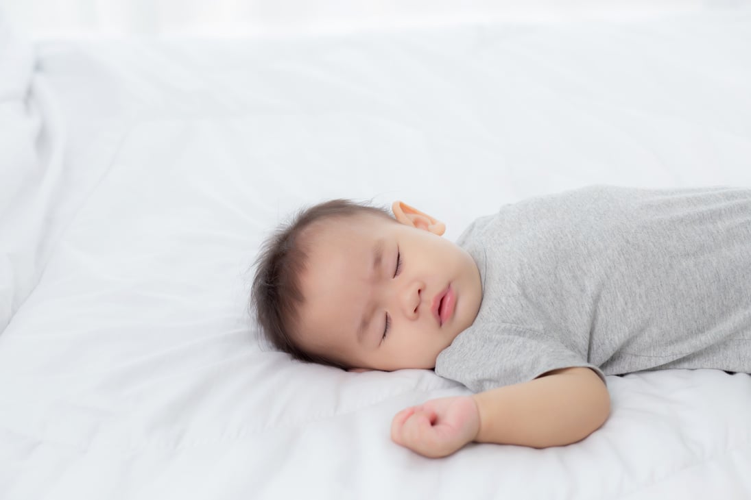 Sleeping Baby on the Bed